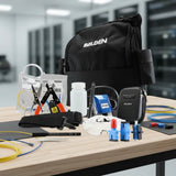 Belden AX104271 professional fiber optic termination kit with tools, connectors, and carrying bag on a wooden table.